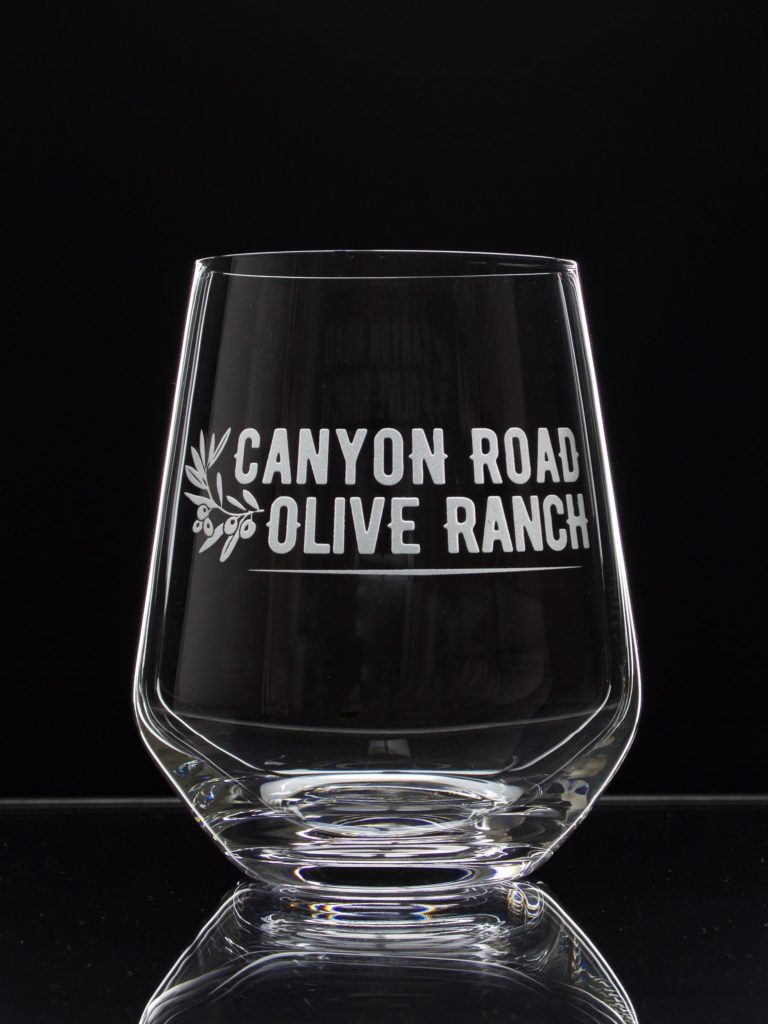 stemless wine glass etched with Canyon Road Olive Ranch logo