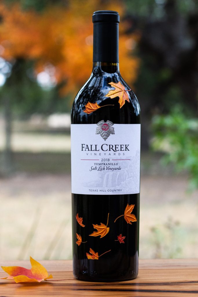 Engraved wine bottle with fall leaves