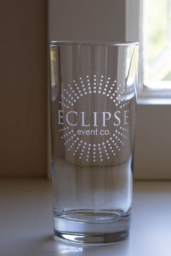 engraved etched sandcarved logo on glass for Eclipse Event Co.