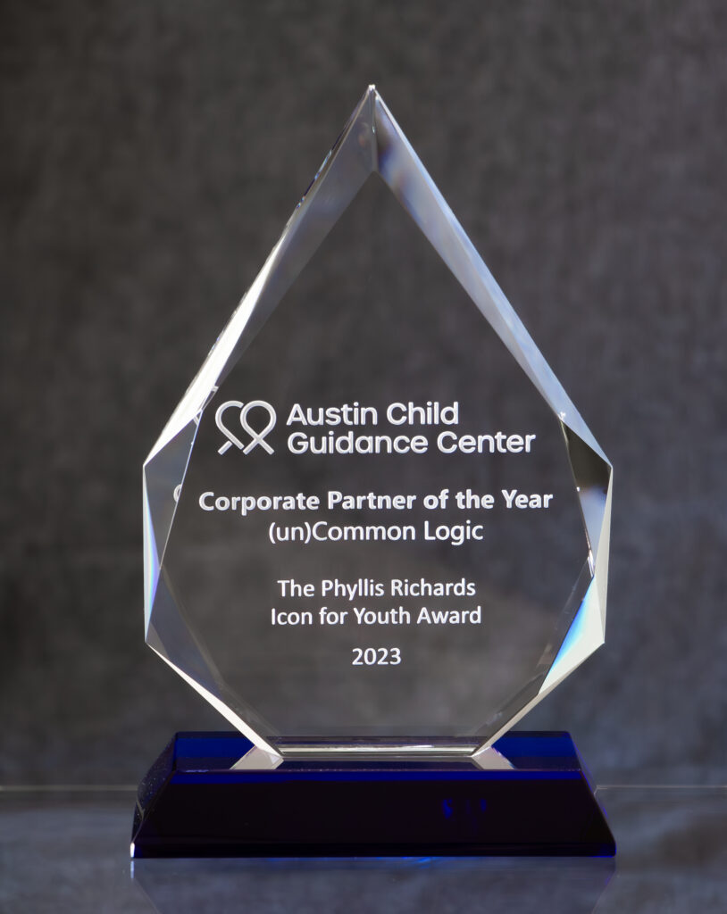 Beautiful sandcarved faceted crystal award with a blue base for Austin Child Guidance Center 2023